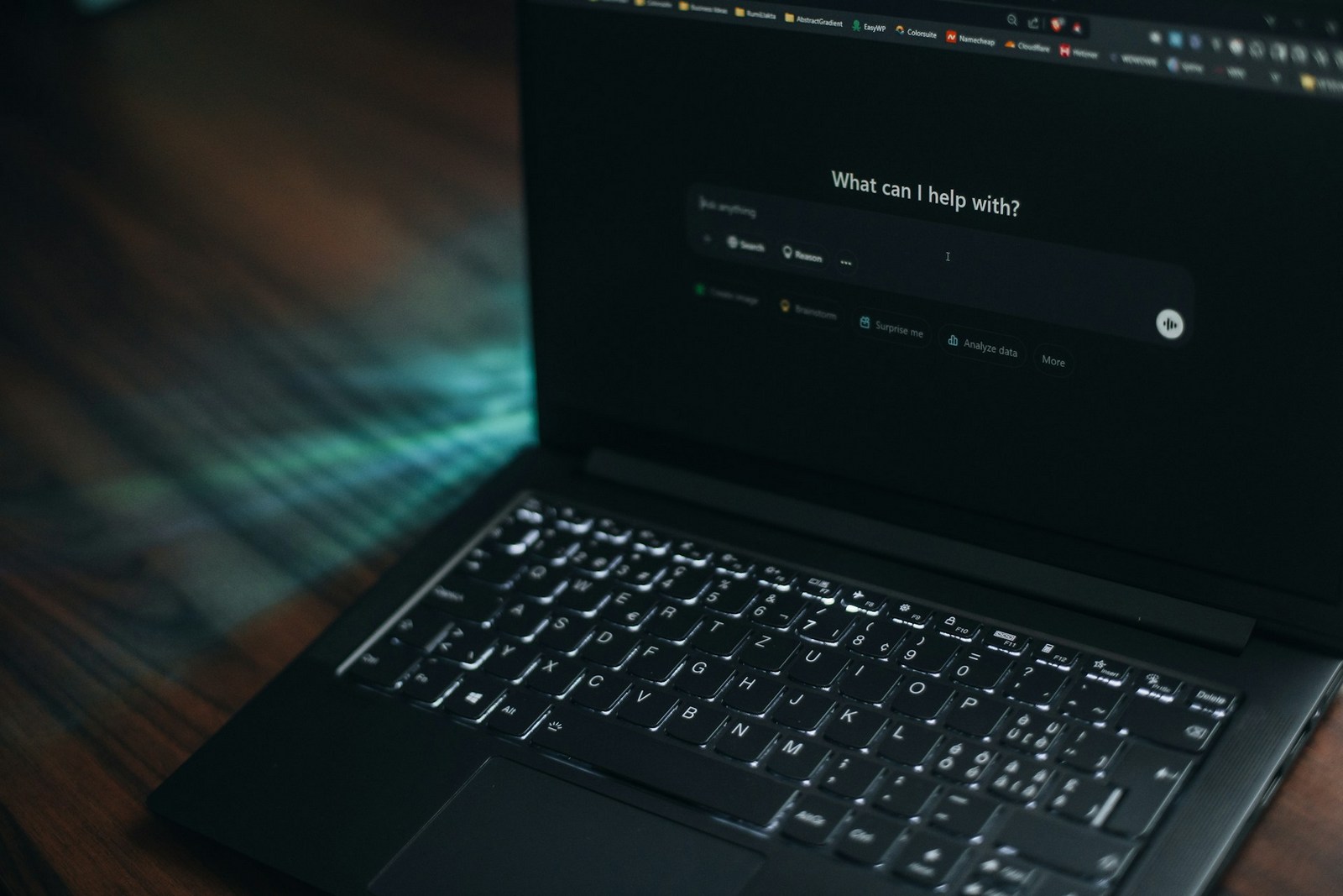 Person at a laptop using an AI chat assistant to ask questions about marketing data